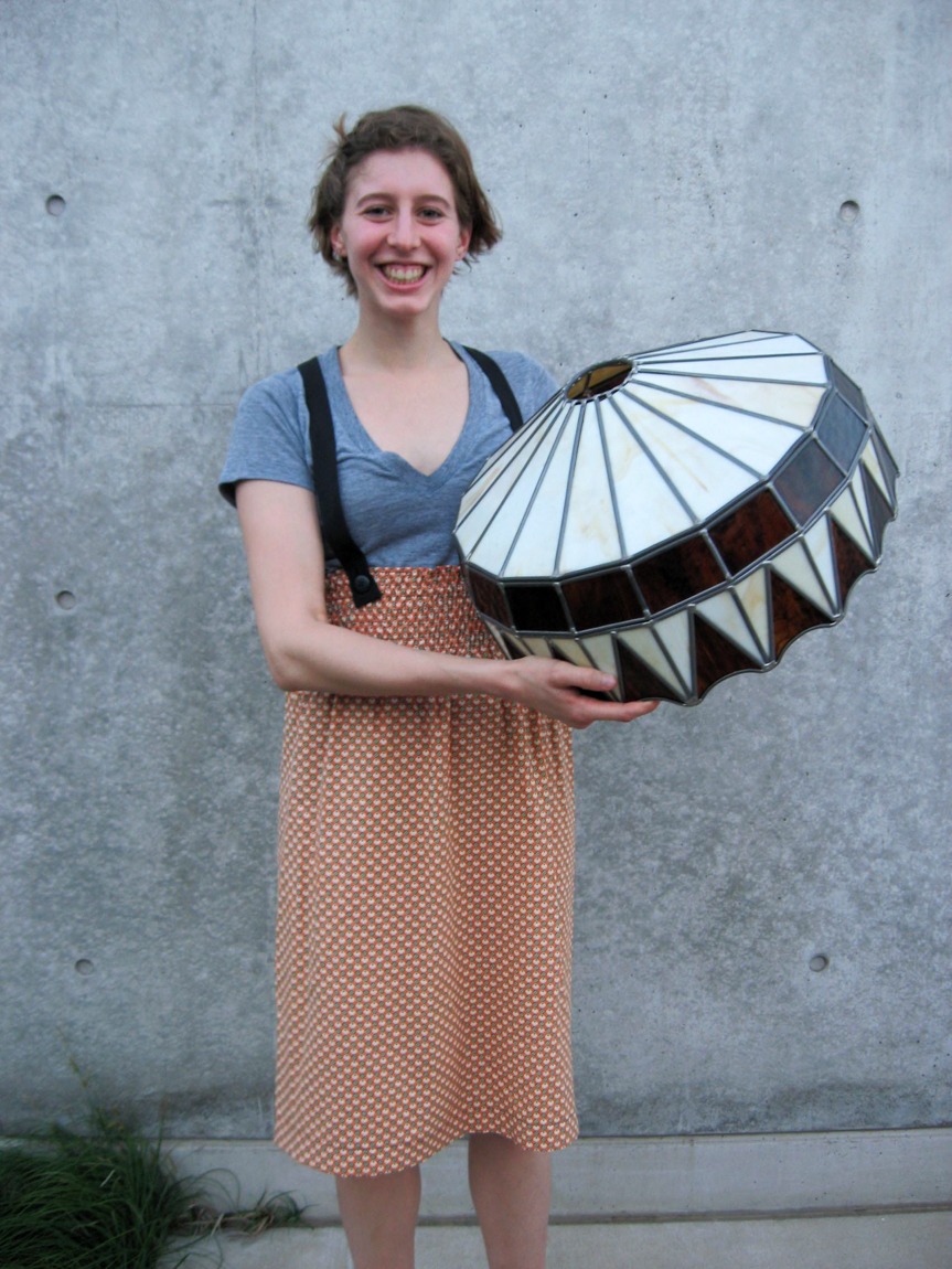 A Lamp Project donor holding their black and white geometric lamp.