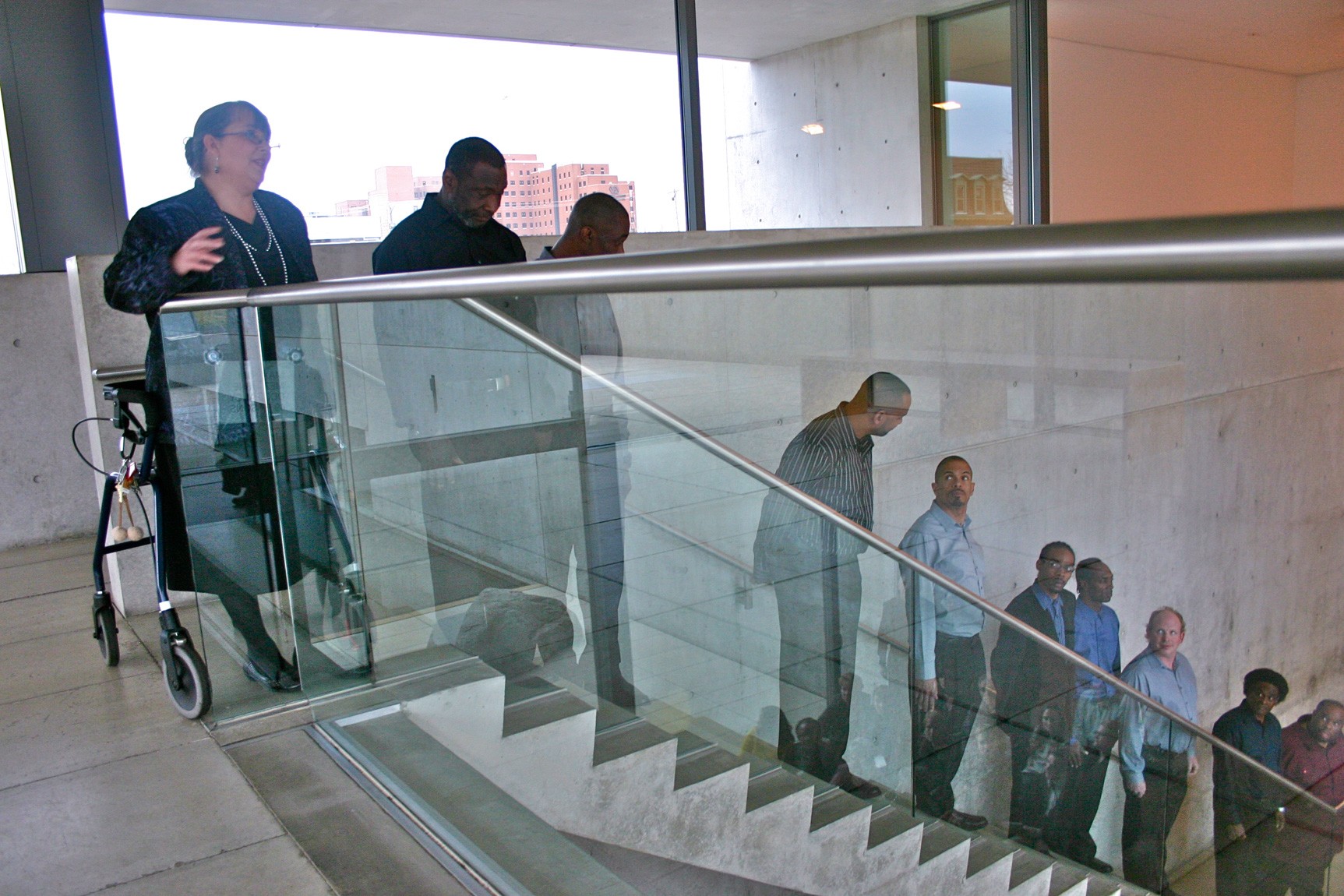 Performers line the Mezzanine staircase.