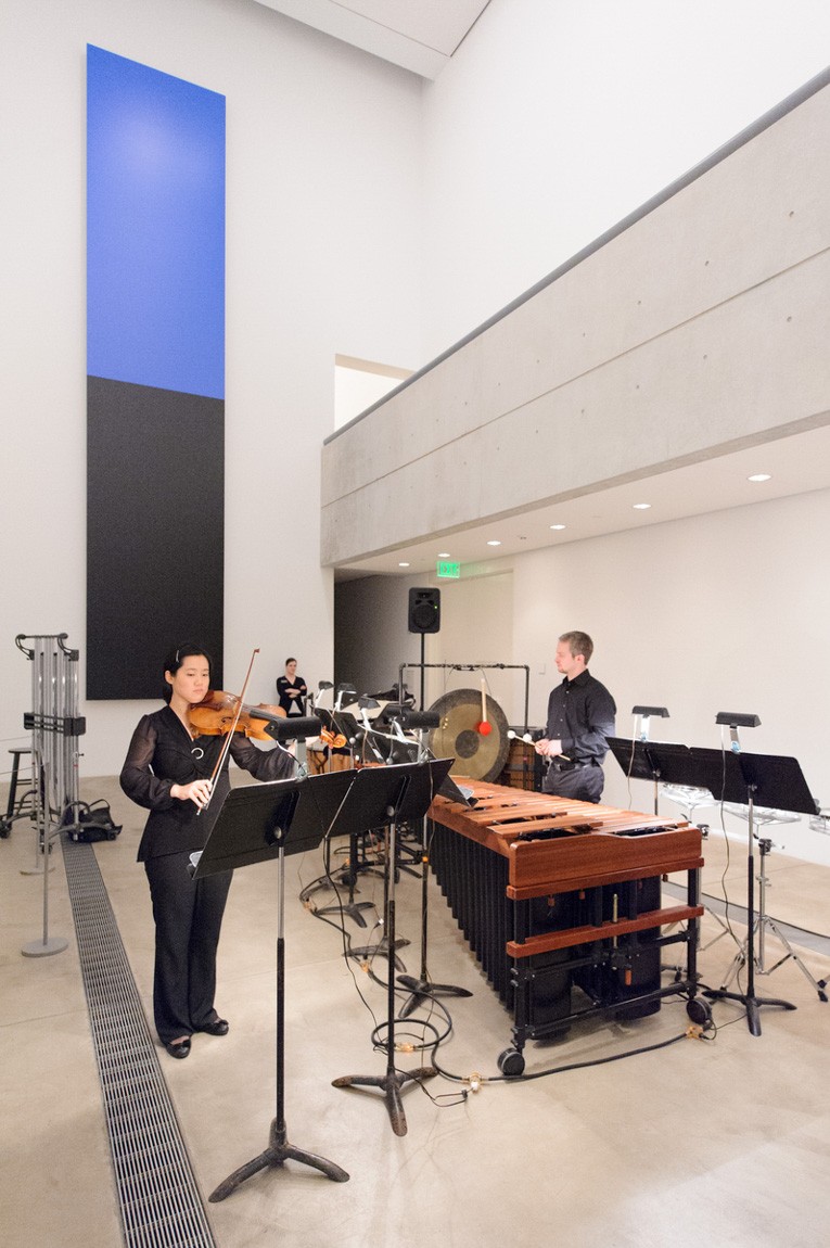 A violist and a percussionist perform in the Lower-Main Gallery.