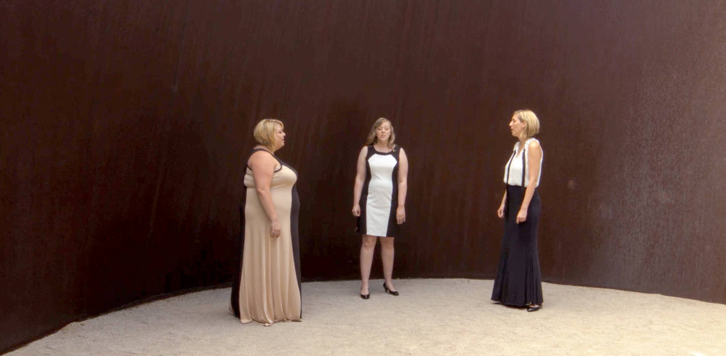 Three singers sing together in Richard Serra's "Joe."