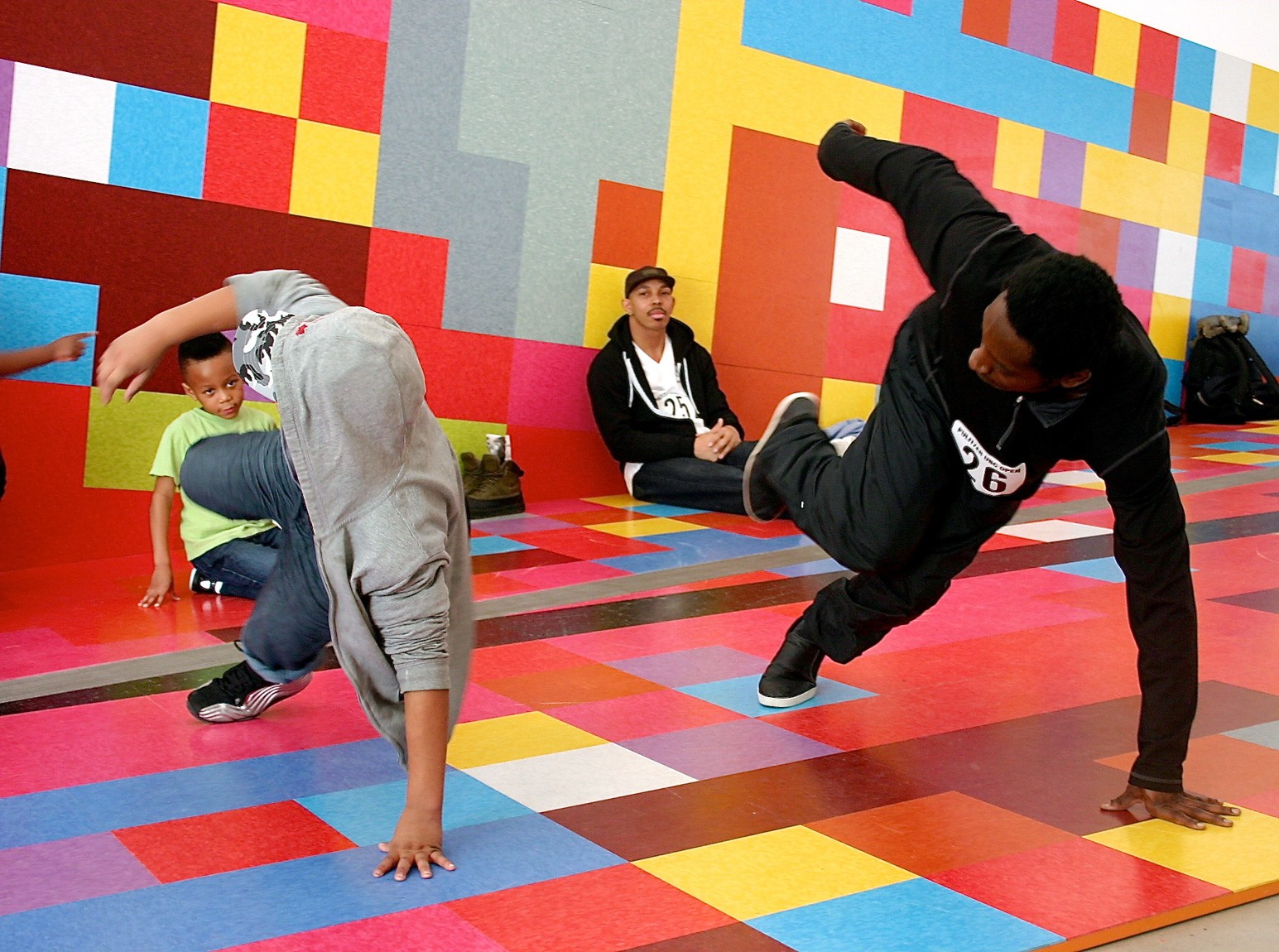 Break dancers perform on the floor of David Scanavino's installation "Candy Crush."