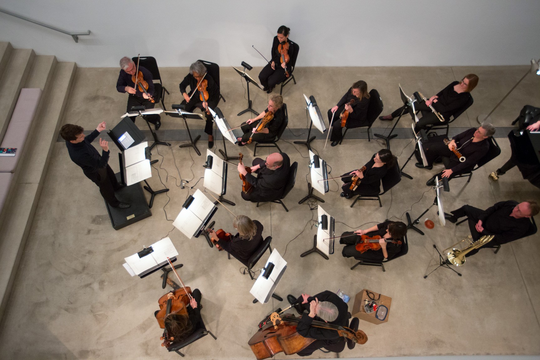 An ensemble of musicians performs in the Lower-Main Gallery.
