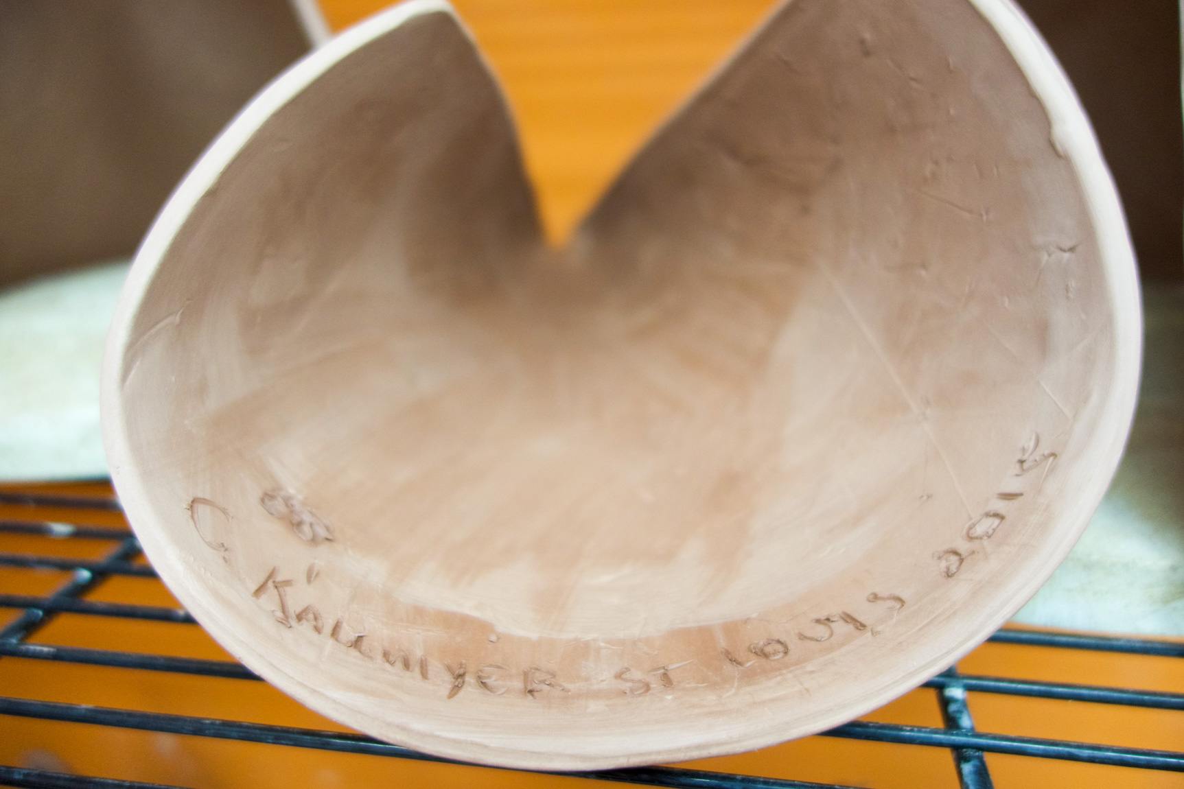 Closeup of the inscription inside an instrument reading "C Kallmyer St. Louis 2015."