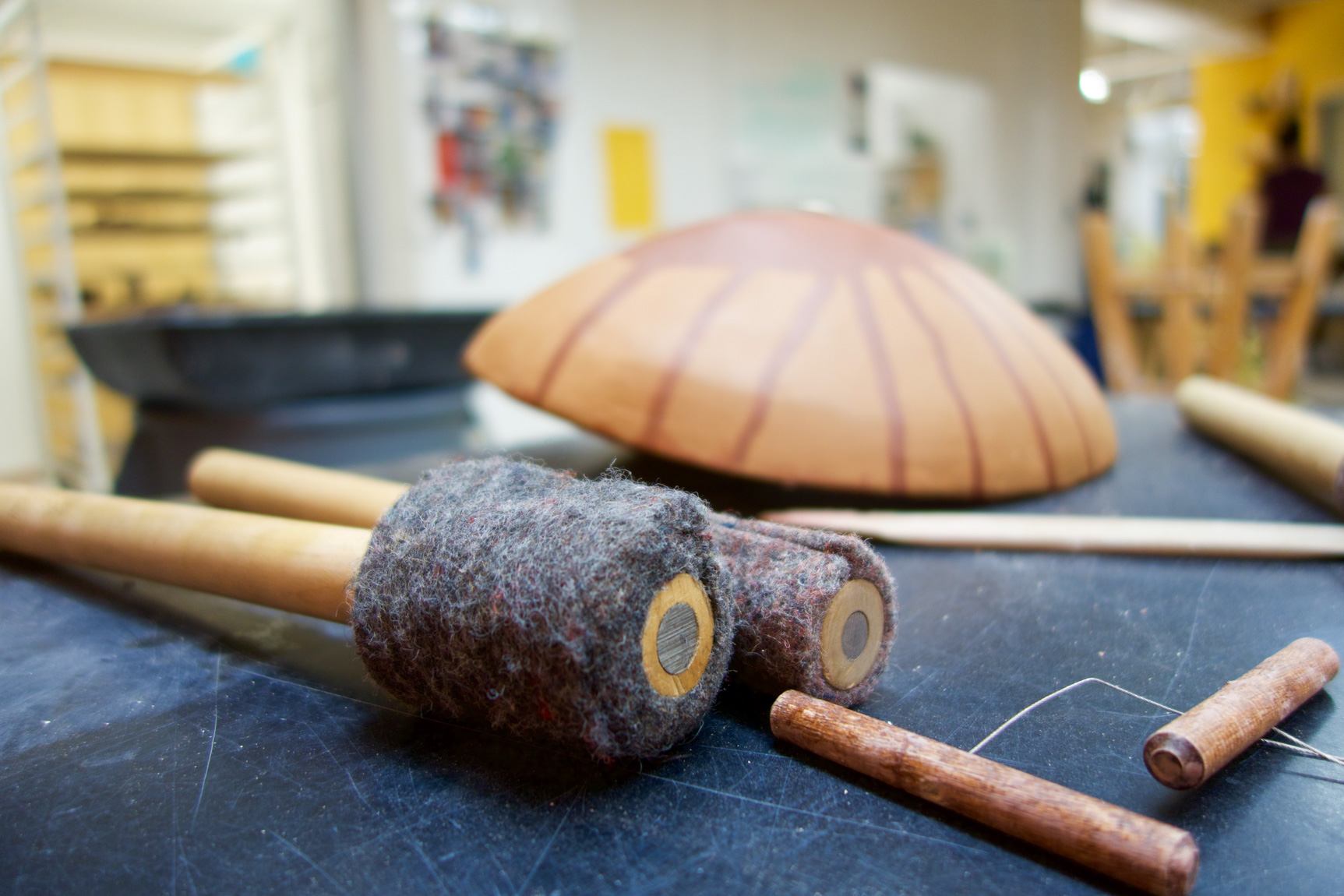 Closeup of felted mallets, sculpting tools, and clay instruments in Kallmyer's studio.