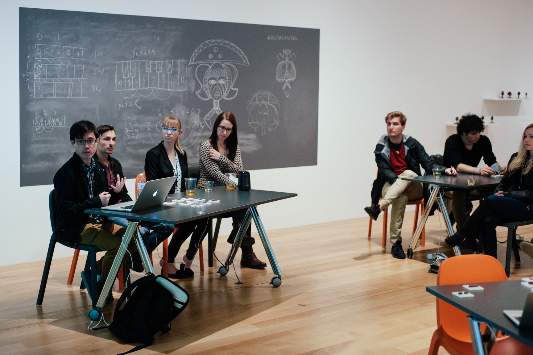 Collaborators attend a presentation in the Lower-West Gallery for a 3-D printing workshop.