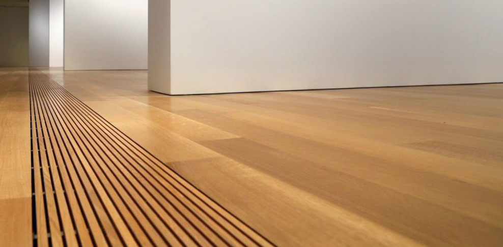 Close up photograph of the new hardwood floor in the Lower East Gallery.