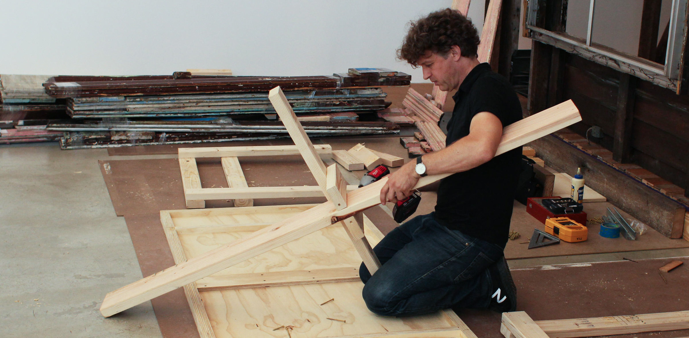 A collaborator assists in the installation process of raumlaborberlin's installation 