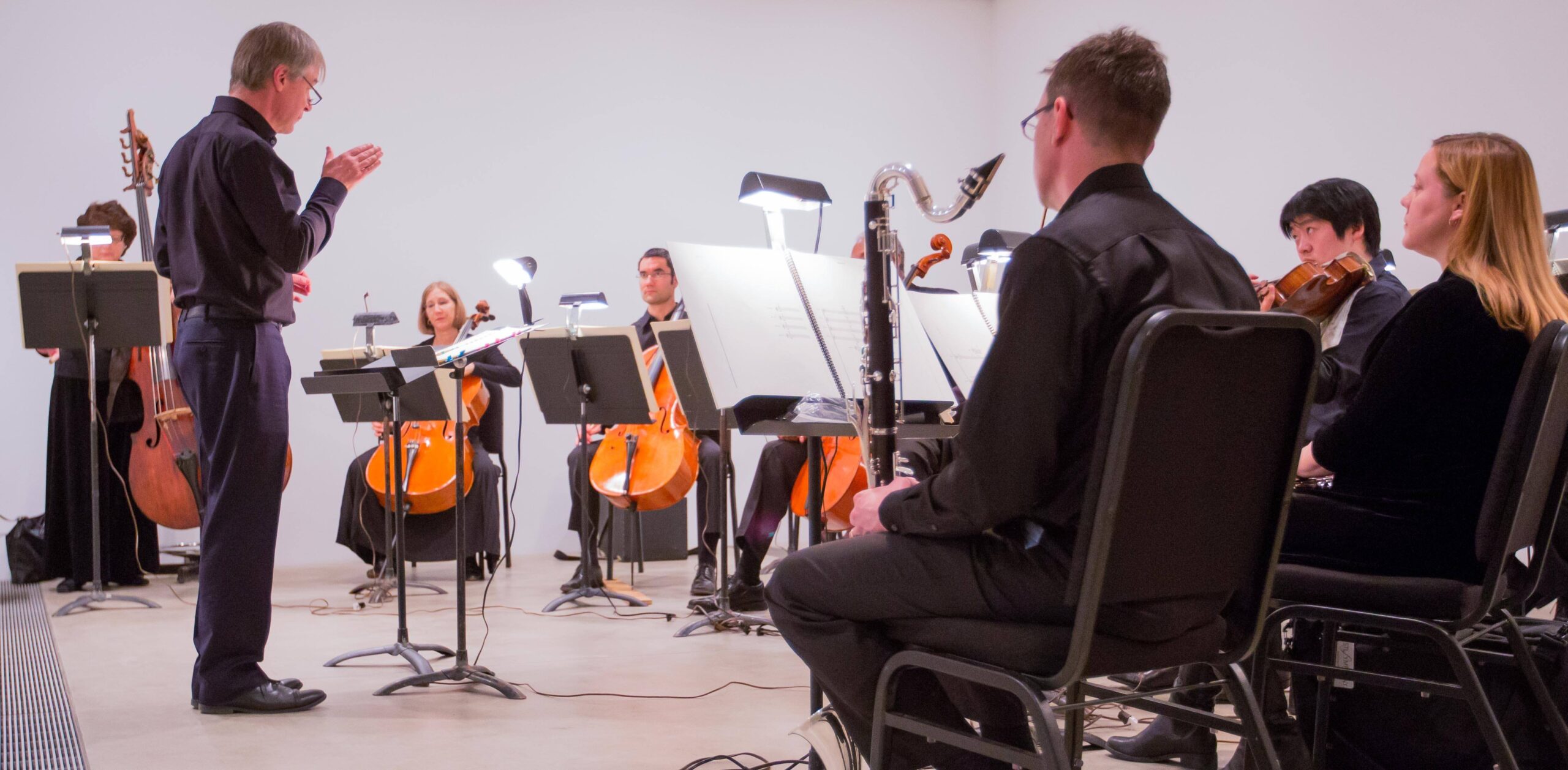 David Robertson conducts a symphony in the Entrance Gallery.