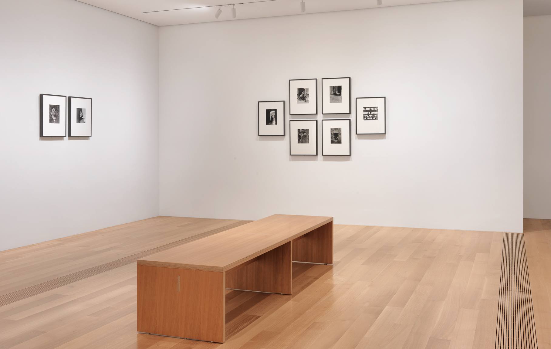 A view of Lola Álvarez Bravo's framed black and white photographs in the Lower West Gallery.