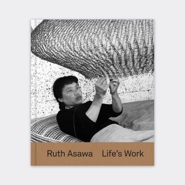 The exhibition catalogue cover for "Ruth Asawa: Life's Work," which includes a photo of Asawa lying beneath a large woven sculpture and weaving.