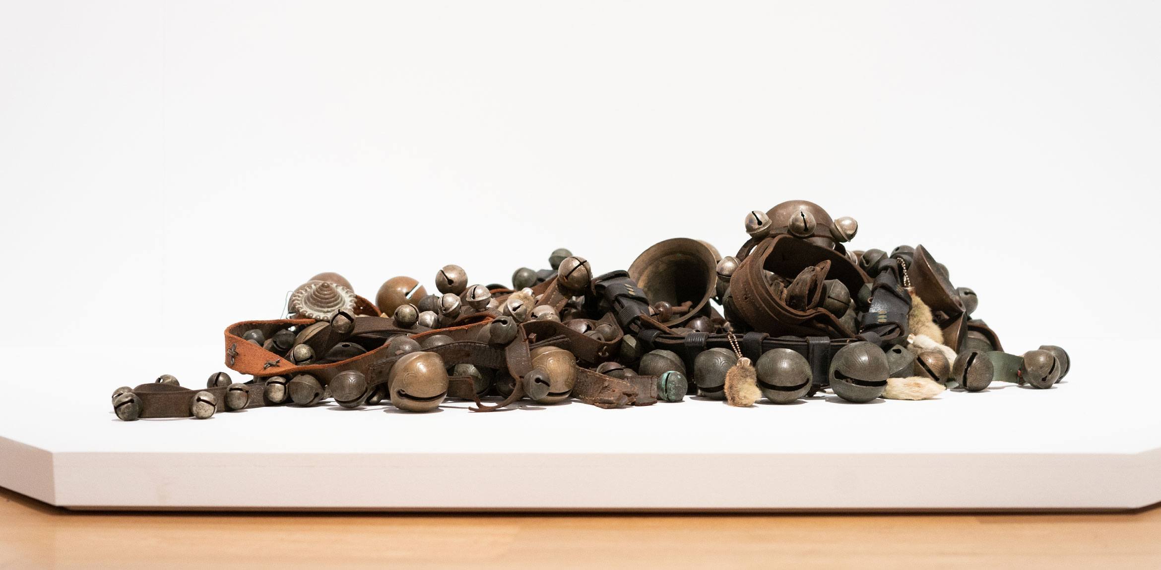 Terry Adkins' "Bells," a pile of metal bells and rabbits' feet fastened to strips of leather.