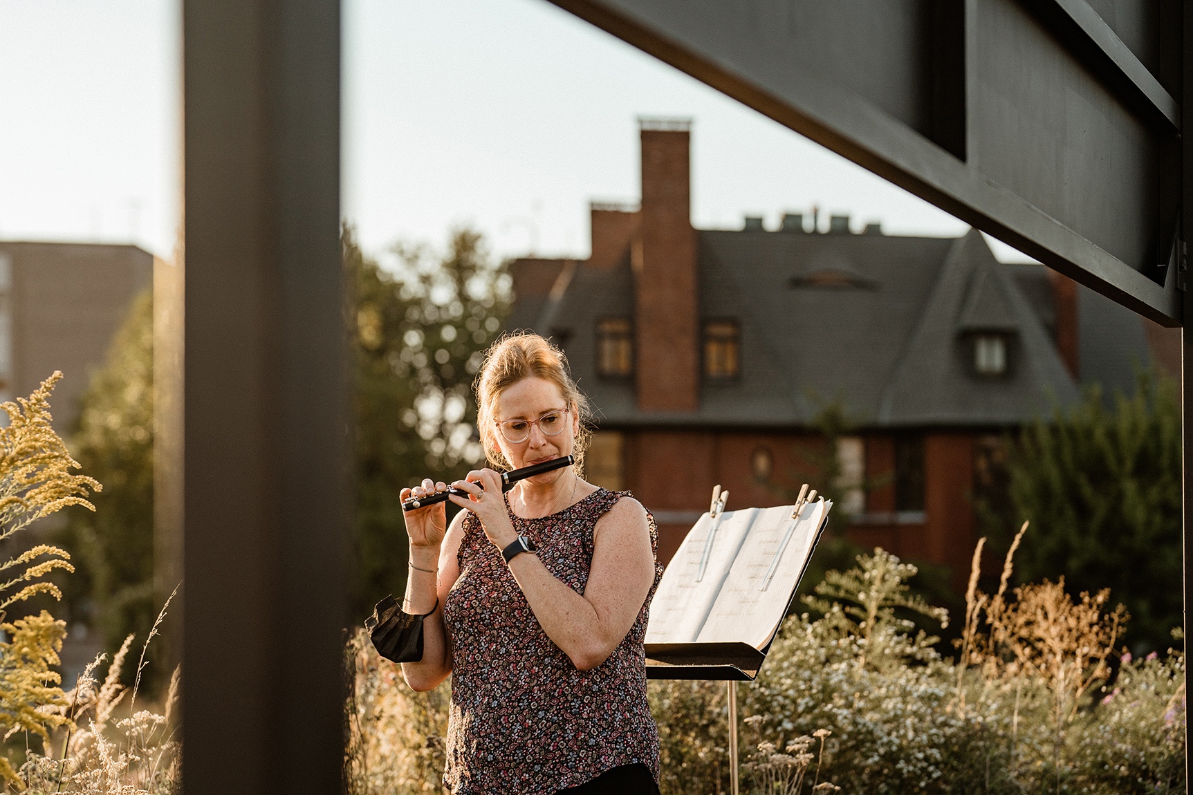 A St. Louis Symphony Orchestra musician performing outdoors in Park-Like