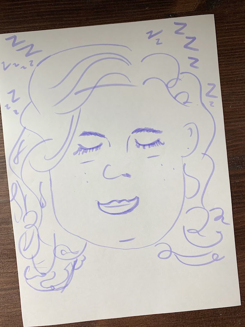 A sketch of a face in purple marker