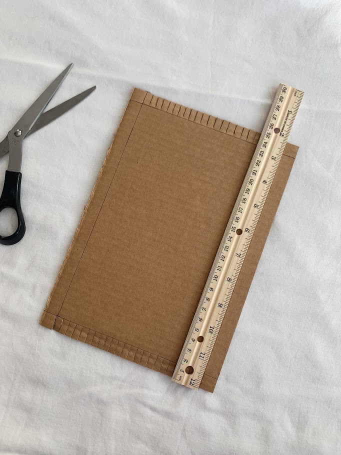 Cardboard, ruler, and scissors