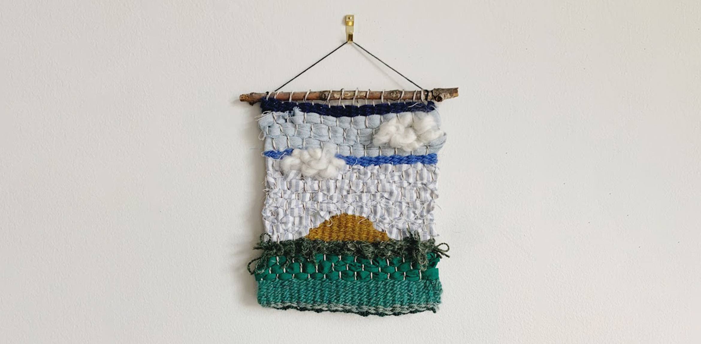 Woven piece of art using upcycled fabric and yarn scraps