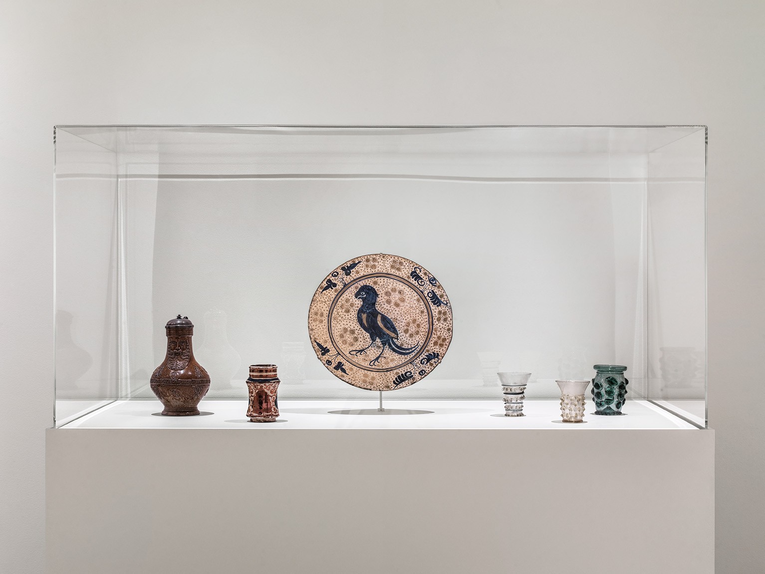 Glass dishes, cups, and bartmann from the middle ages on display at the Pulitzer Arts Foundation
