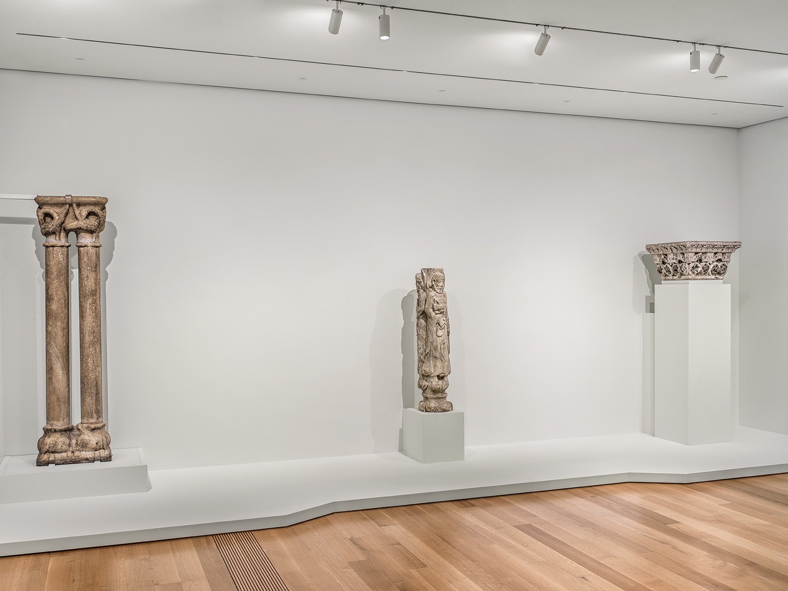 Three stone columns from the middle ages on display at the Pulitzer