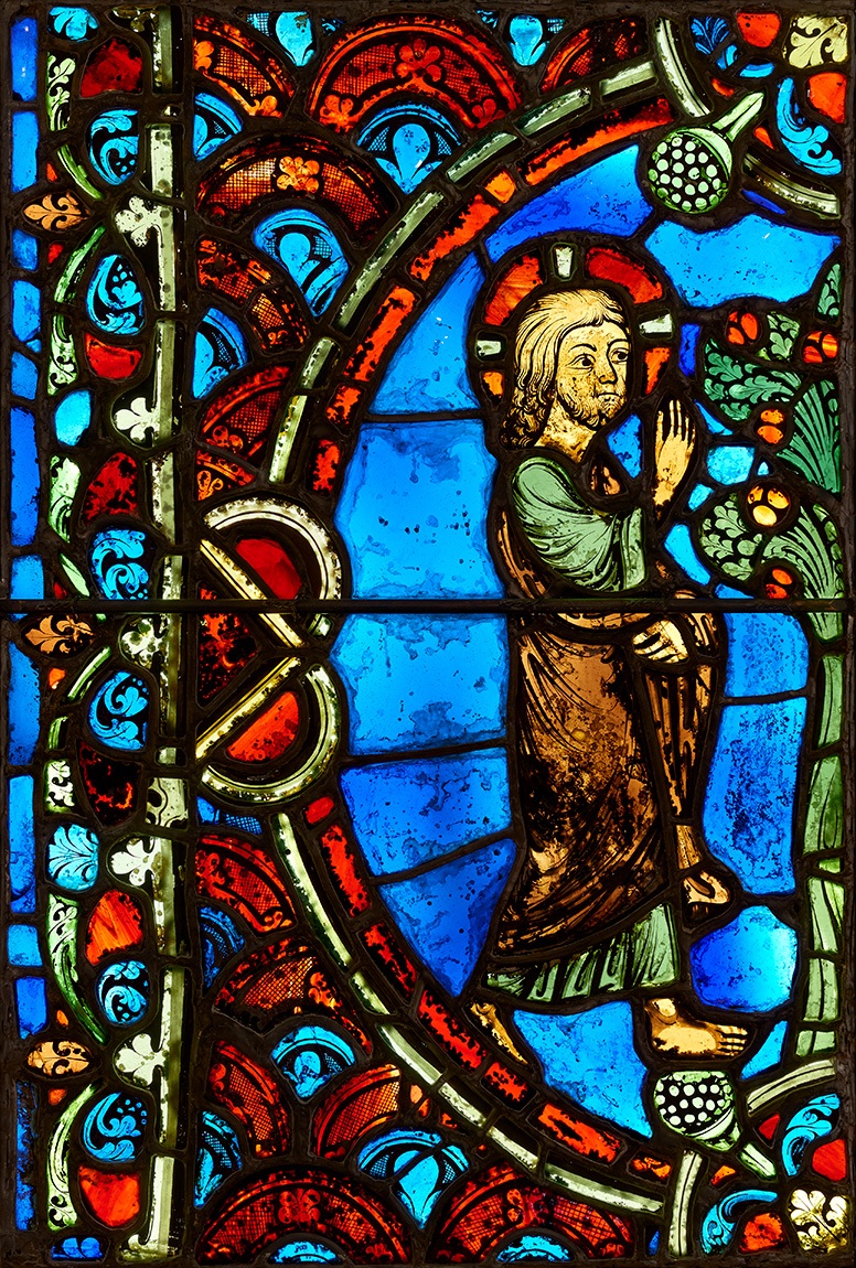 Stained glass window of person and tree