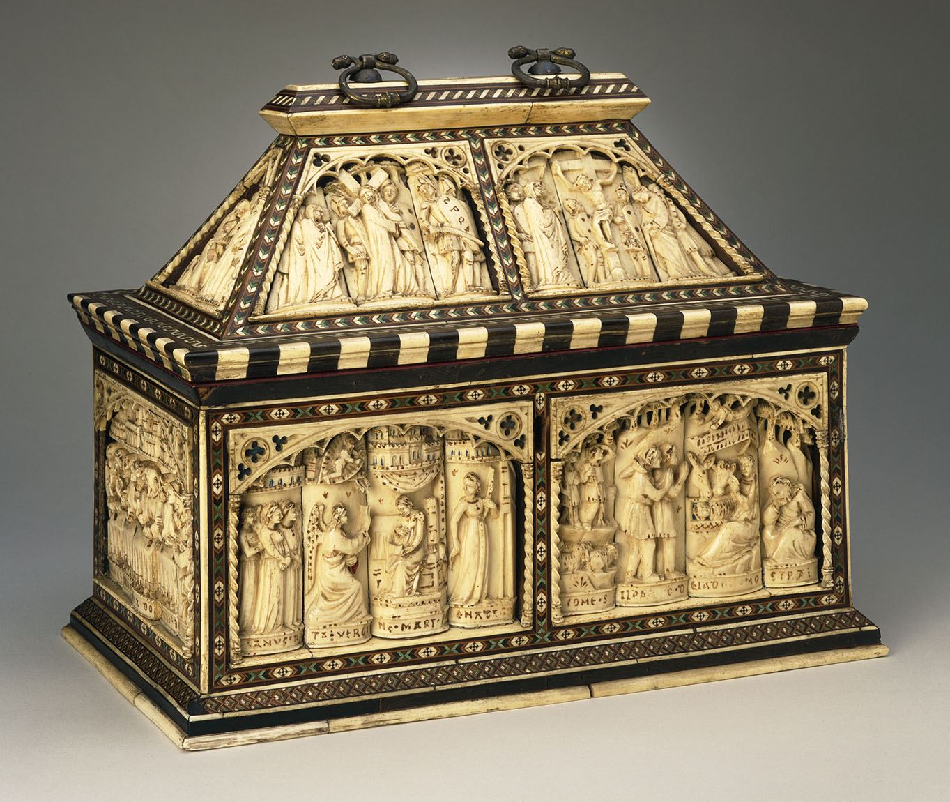 Decorative casket made of carved bone, stained horn, wood, pigment, and gilt metal from the 1400s