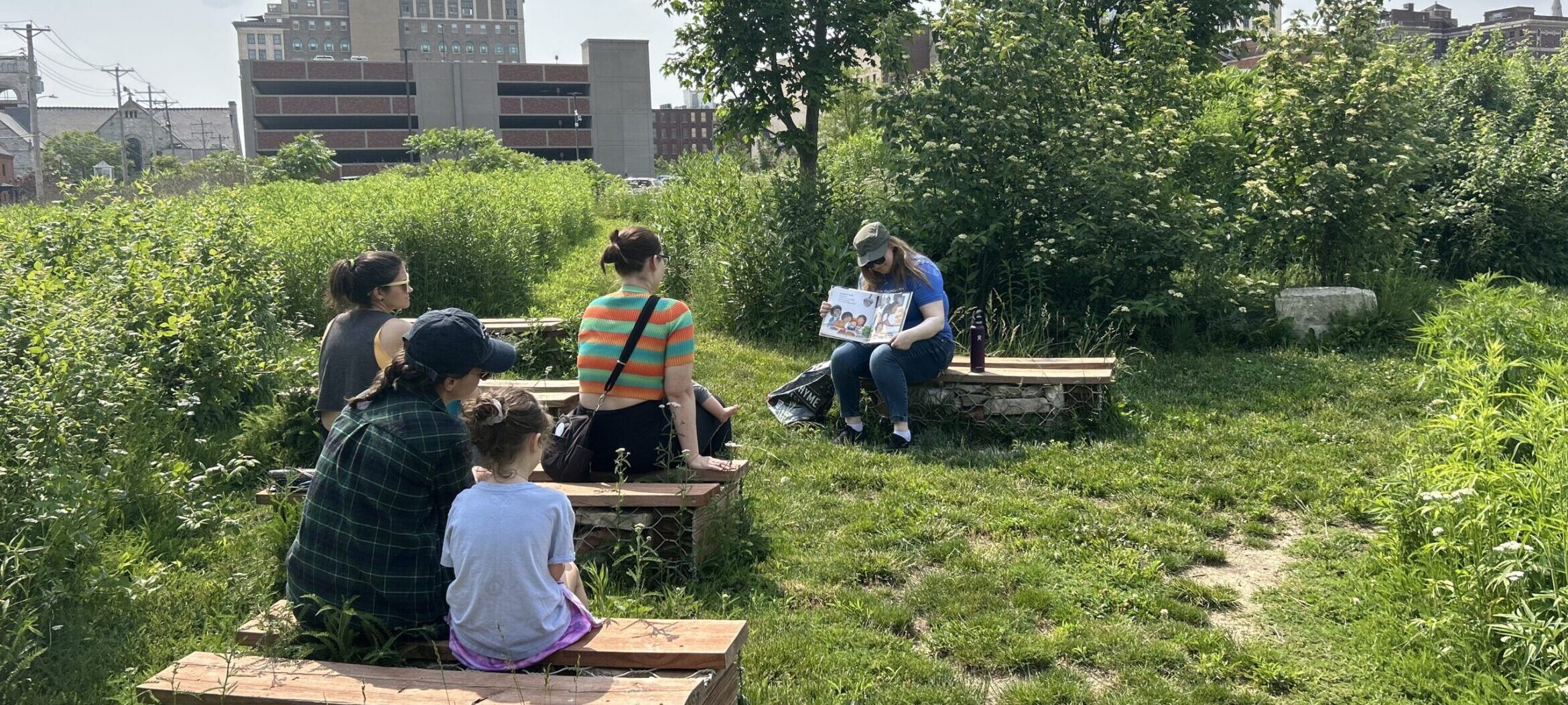Children and parents attending Storytime in Park-Like