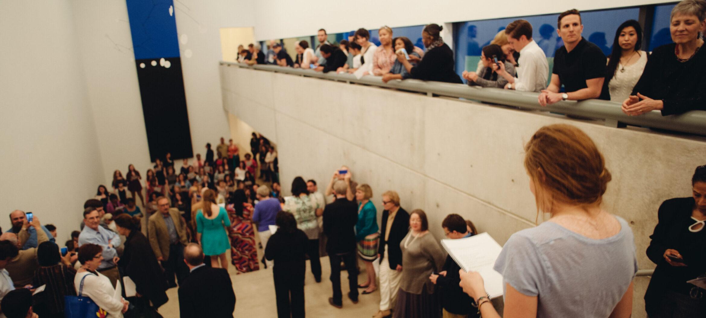Visitors gathering in the main gallery of a public reception at the Pulitzer.