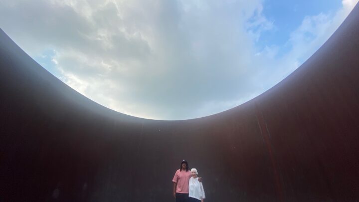 Jay-Z and Emily Rauh Pulitzer standing inside Richard Serra's sculpture at the Pulitzer Arts Foundation