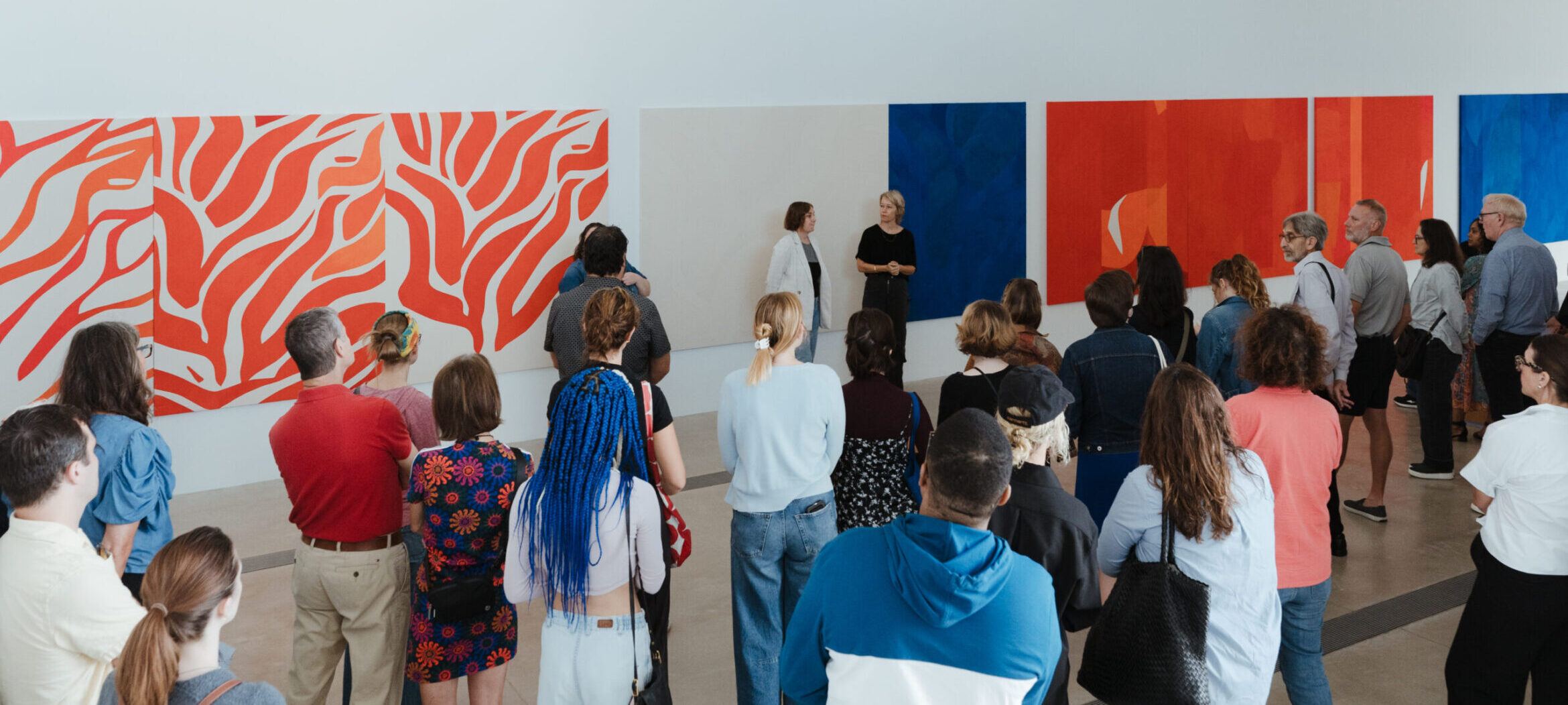 Visitors gathering for a tour of "Sarah Crowner: Around Orange" at the Pulitzer Arts Foundation.