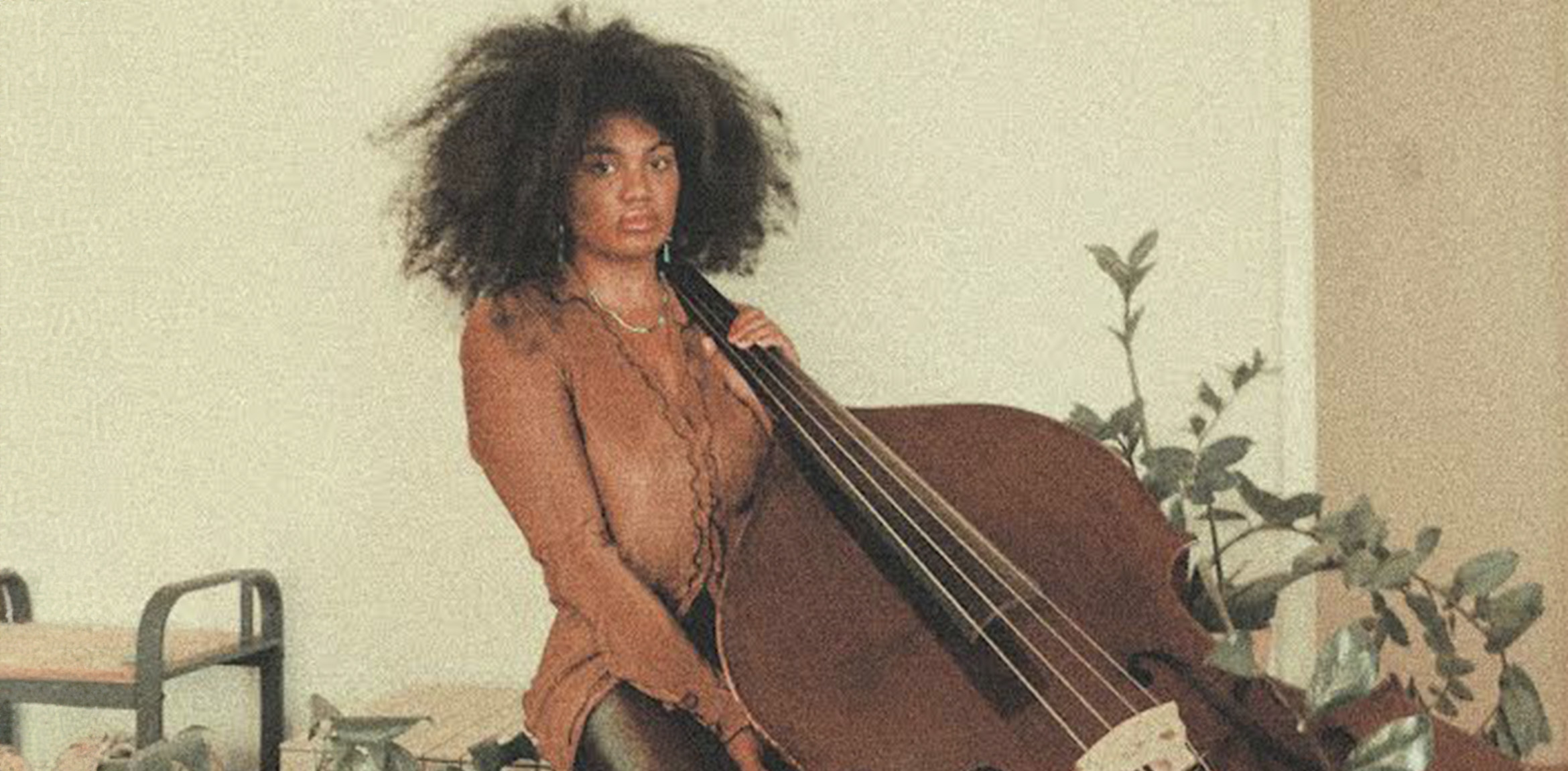 Portrait of Tonina seated with a cello