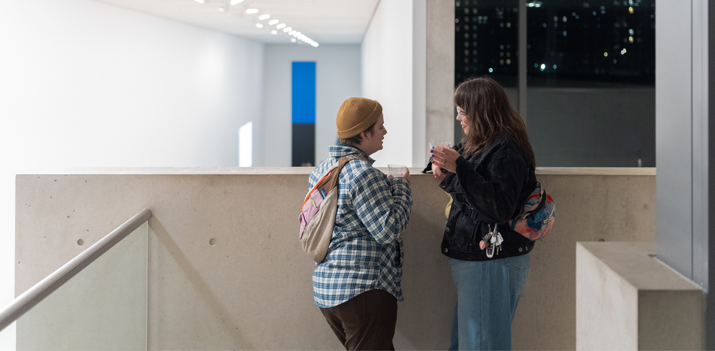 Two people having a conversation on the Pulitzer Mezzanine with 